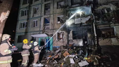 03 October 2024, Ukraine, Kharkiv: Firefighters extinguish the fire in a residential building that was damaged by a Russian missile attack. Photo: ---/Ukrinform/dpa