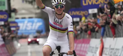 Reigning World Champion Slovenia's Tadej Pogacar celebrates winning Il Lombardia, Tour of Lombardy cycling race, in Como, Italy, Saturday, Oct. 12, 2024. (Gian Mattia D'Alberto/LaPresse via AP)