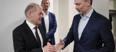 FILED - 26 February 2024, Berlin: German Chancellor Olaf Scholz (L) greets Minister of Finance Christian Lindner backstage at the Chief Editors' Conference 2024 in the dpa newsroom. Scholz has sacked Finance Minister Christian Lindner of the pro-business Free Democrats, a government spokesman told dpa on Wednesday evening, as Germany's troubled coalition government threatened to collapse. Photo: Michael Kappeler/dpa