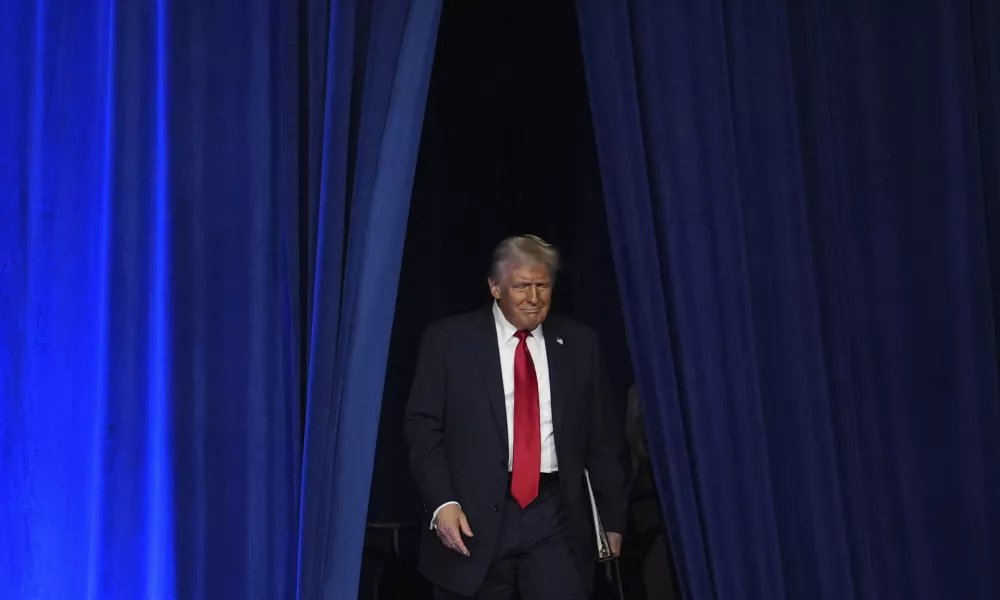 Republican presidential nominee former President Donald Trump arrives at an election night watch party at the Palm Beach Convention Center, Wednesday, Nov. 6, 2024, in West Palm Beach, Fla. (AP Photo/Evan Vucci)