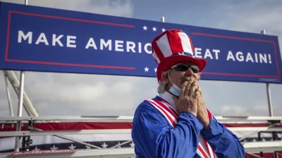 ﻿Phil Eason wears an Uncle Sam costume during the Make America Great Again Victory rally with Vice President Mike Pence at the Piedmont Triad International Airport in Greensboro, N.C., on Tuesday, Oct. 27, 2020. (Khadejeh Nikouyeh/News & Record via AP)