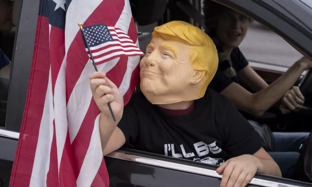 Supporters of President-elect Donald Trump participate in a victory parade, Sunday, Nov. 17, 2024, in West Palm Beach, Fla. (AP Photo/Alex Brandon)