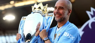 FILE PHOTO: Soccer Football - Premier League - Manchester City v West Ham United - Etihad Stadium, Manchester, Britain - May 19, 2024 Manchester City manager Pep Guardiola celebrates with the trophy after winning the Premier League Action Images via Reuters/Lee Smith EDITORIAL USE ONLY. NO USE WITH UNAUTHORIZED AUDIO, VIDEO, DATA, FIXTURE LISTS, CLUB/LEAGUE LOGOS OR 'LIVE' SERVICES. ONLINE IN-MATCH USE LIMITED TO 120 IMAGES, NO VIDEO EMULATION. NO USE IN BETTING, GAMES OR SINGLE CLUB/LEAGUE/PLAYER PUBLICATIONS. PLEASE CONTACT YOUR ACCOUNT REPRESENTATIVE FOR FURTHER DETAILS../File Photo