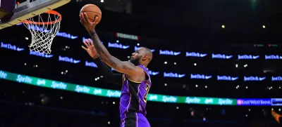 Nov 19, 2024; Los Angeles, California, USA; Los Angeles Lakers forward LeBron James (23) scores a basket against the against the Utah Jazz during the first half at Crypto.com Arena. Mandatory Credit: Gary A. Vasquez-Imagn Images