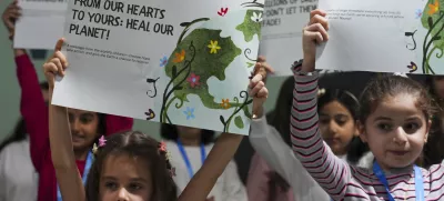 Children advocate for a clean planet during the COP29 U.N. Climate Summit, Thursday, Nov. 21, 2024, in Baku, Azerbaijan. (AP Photo/Peter Dejong)