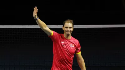 Tennis - Davis Cup Finals - Quarter Final - Netherlands v Spain - Palacio de Deportes Jose Maria Martin Carpena Arena, Malaga, Spain - November 20, 2024 Spain's Rafael Nadal waves at fans during a tribute to his career after The Netherlands eliminated Spain REUTERS/Jon Nazca