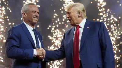 Republican presidential nominee former President Donald Trump shakes hands with Independent presidential candidate Robert F. Kennedy Jr. at a campaign rally at the Desert Diamond Arena, Friday, Aug. 23, 2024, in Glendale, Ariz. (AP Photo/Evan Vucci)