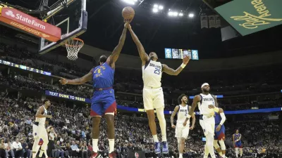 Denver Nuggets center DeAndre Jordan (6) and Dallas Mavericks forward P.J. Washington (25) go after a rebound during the second half of an Emirates NBA Cup basketball game Friday, Nov. 22, 2024, in Denver. (AP Photo/Jack Dempsey)