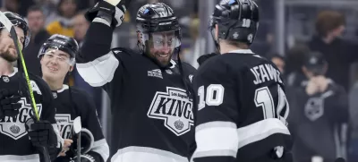 Los Angeles Kings center Anze Kopitar, left, celebrates with left wing Tanner Jeannot after the team's win against the Winnipeg Jets in an NHL hockey game Wednesday, Nov. 27, 2024, in Los Angeles. (AP Photo/Ryan Sun)