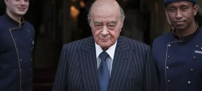 FILE - Egyptian businessman and Ritz hotel owner Mohamed Al Fayed poses with his hotel staff in Paris, June 27, 2016. Al Fayed, the former Harrods owner whose son Dodi was killed in a car crash with Princess Diana, has died at age 94. His death was announced Friday, Sept. 1, 2023, by Fulham Football Club, which Al Fayed once owned. (AP Photo/Kamil Zihnioglu, File)